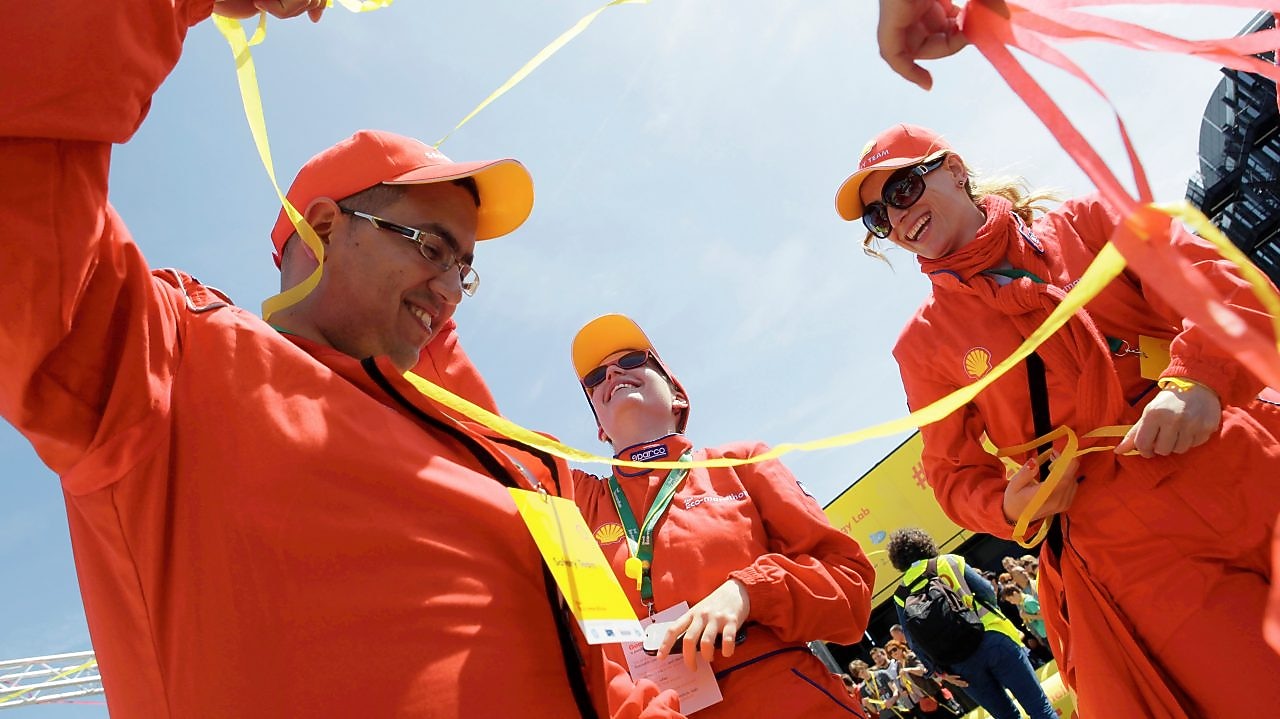 Laughing creative business people working in office