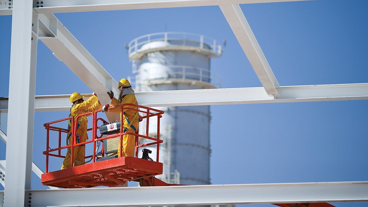 Engineers working on crane